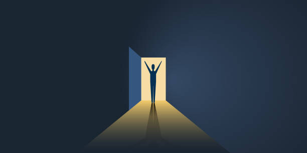 istock Happy Man in a Dark Room with Light Through an Open Door 1146265483