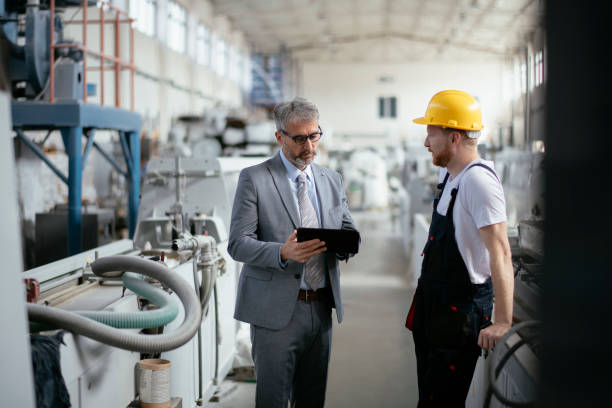 istock Factory. Worker. Manager. Engineer. Factory worker explaining the process to his boss. 1146275493