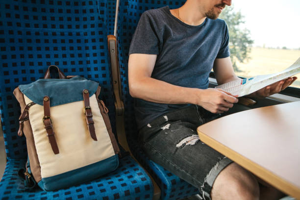 istock A tourist in a train looks at a map 1146276702