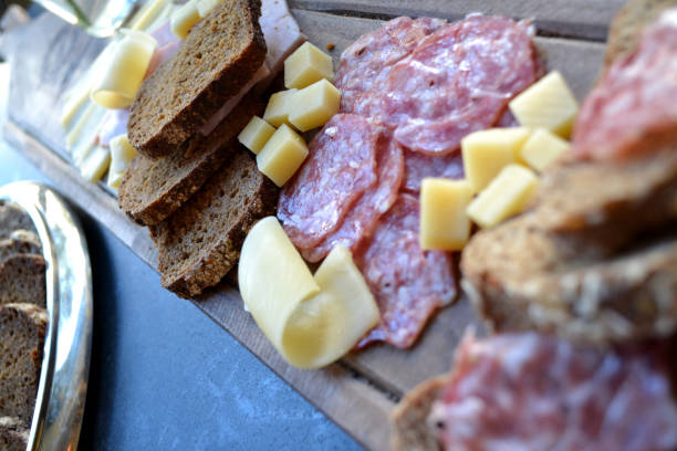 istock The sliced sausages and cheese on a kitchen table. 1146277656