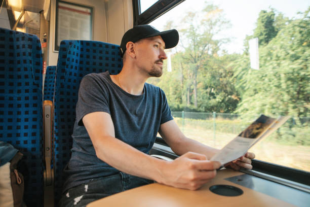 istock A tourist in a train looks at a map 1146277738