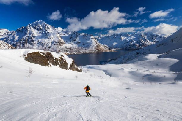 istock Skitouring downhill - powder skiing at  Lofoten - Norway 1146278113