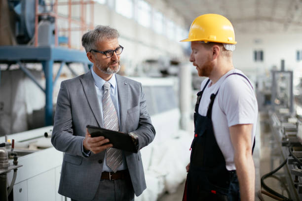 istock Factory. Worker. Manager. Inspector. Factory worker with quality inspector. 1146279161