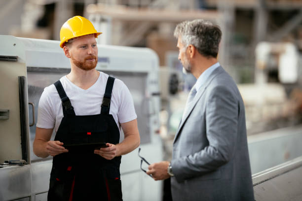 istock Factory. Worker. Manager. Inspector. Factory worker with quality inspector. 1146279368