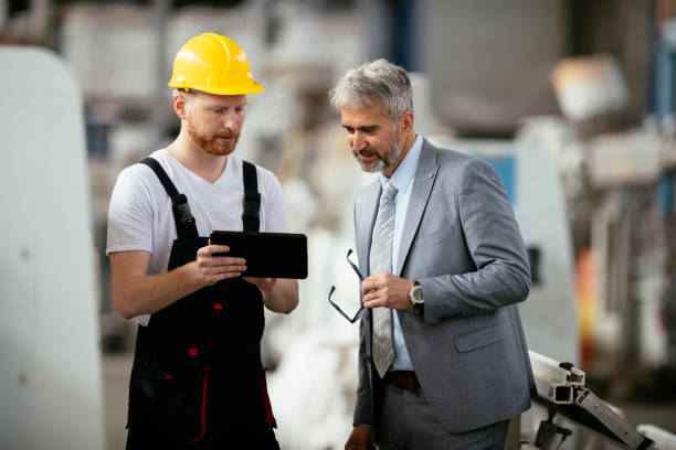 istock Factory. Worker. Manager. Inspector. Factory worker with quality inspector. 1146279782