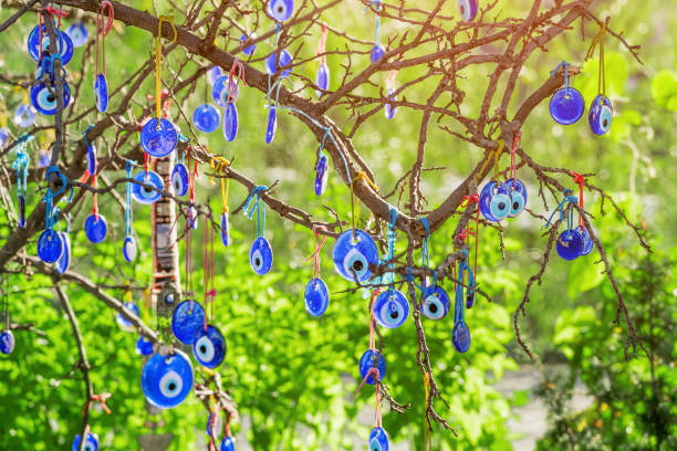 istock Evil eye charms hang on a green tree at summer in Cappadocia, Turkey. 1146280948