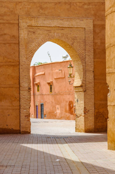 Empty street through a gate in Marrakech, Morocco stock photo