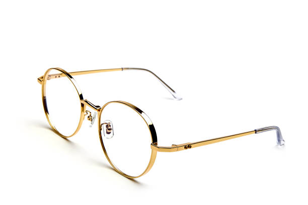 istock Gold framed glasses on white background 1146281375