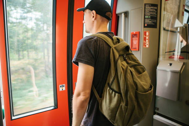 istock Tourist guy rides in train 1146282285