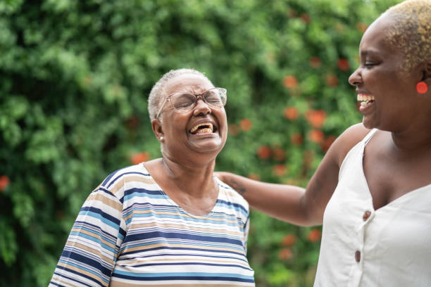 istock Portrait of mother and daughter laughing together 1146283473