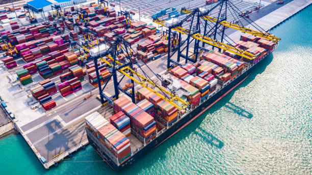 istock Top view Aerial view cargo ship, loading and unloading goods at the deep sea port Singapore 1146284674