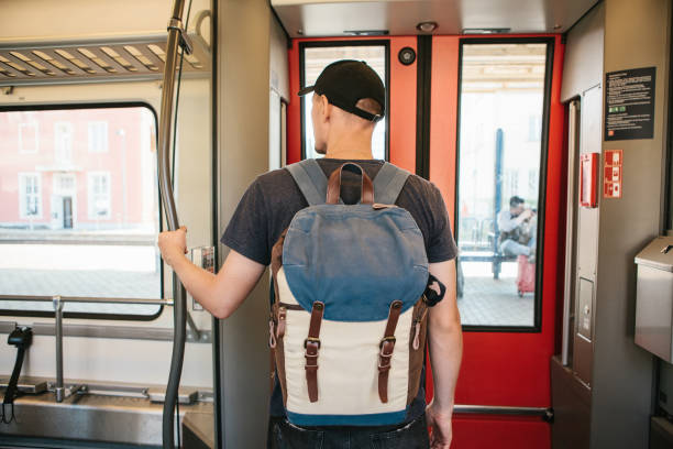 istock Tourist guy rides in train 1146285276