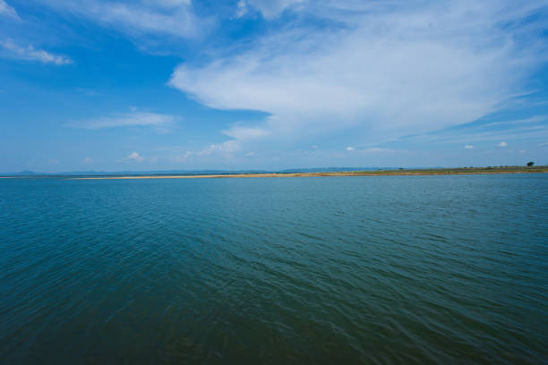 A dried up empty reservoir or dam during a summer heatwave, low rainfall and drought in thailand