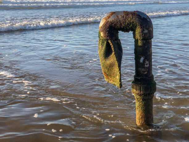 waste pipe into the atlantic ocean at agadir, morocco - toxic substance spilling pouring bottle imagens e fotografias de stock