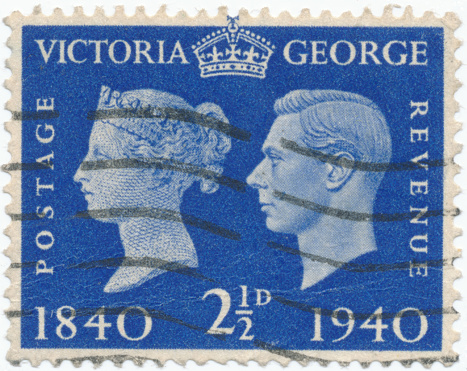 POLTAVA, UKRAINE - APRIL 21, 2019. Vintage stamp printed in Great Britain 1937 shows Queen Victoria and King George VI