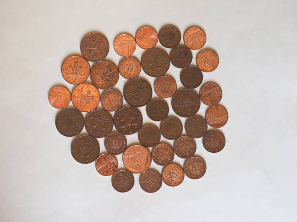 penny and pence coins, united kingdom - british currency coin two pence coin british coin imagens e fotografias de stock