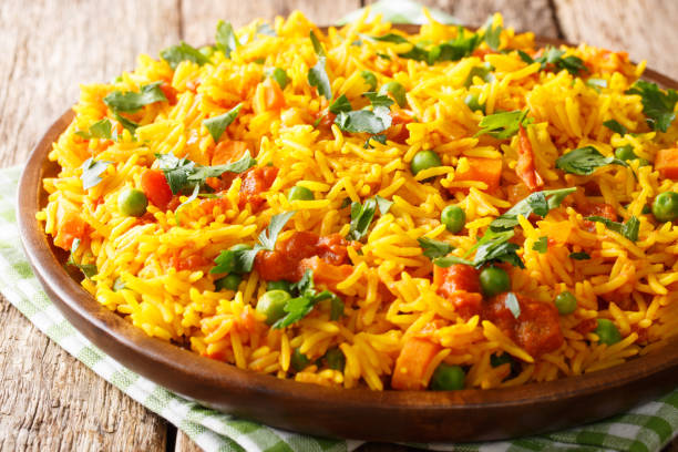 istock Vegetarian Indian rice with vegetables close-up on a plate. horizontal, rustic style 1146288846