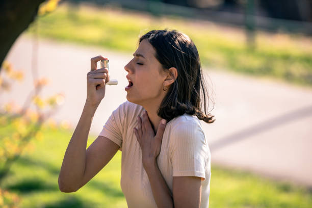 istock Woman Using Asthma Inhaler Outdoor 1146290531