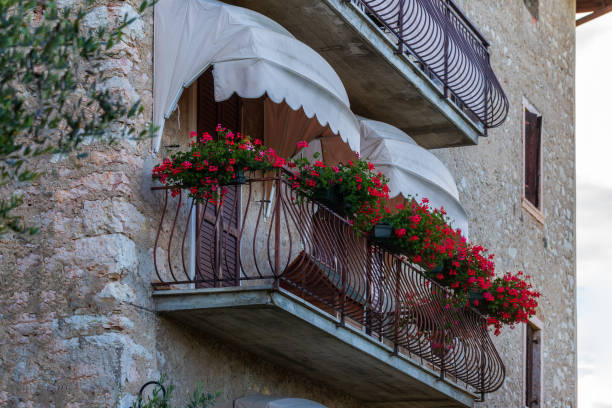 istock Traditional balcony with flowers in Italy 1146292087