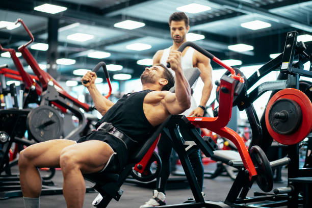 istock Workout. Gym. Weight Training. Bodybuilding. Bodybuilder having training in the gym 1146295333
