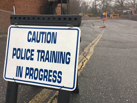 Police training in progress sign in front of school .