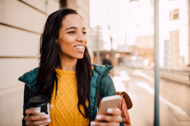 istock Happy girl using smart phone 1146297686