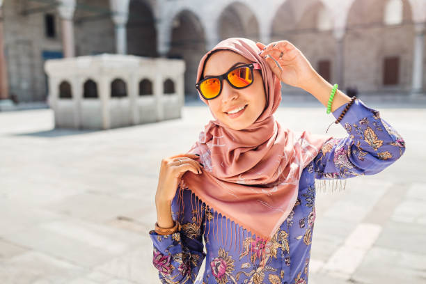 Happy attractive muslim woman travel in Turkey, posing in courtyard of Suleymaniye mosque, religion and tourist concept. Happy attractive muslim woman travel in Turkey, posing in courtyard of Suleymaniye mosque, religion and tourist concept. turkey koran people design stock pictures, royalty-free photos & images