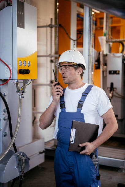 istock Engineer. Factory worker. Refinery. Handsome factory worker controlling production. 1146300657