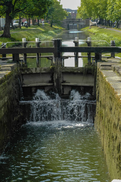 istock Floodgate on river in town. 1146300671