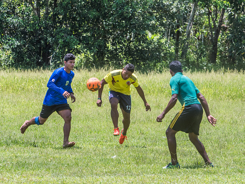 Santa Rita, Peru - Sep 19, 2018: Local people playing football in a small village in the middle of the Amazon Rain Forest, Border of Peru and Brazylia.