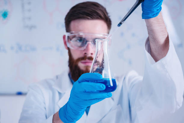 Close Up Of Young Scientists Working In Laboratory