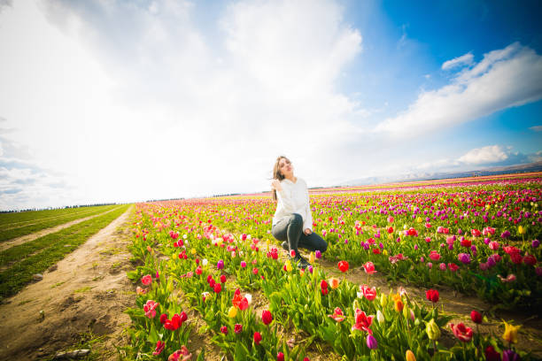 istock young model in a field of tulips 1146304343