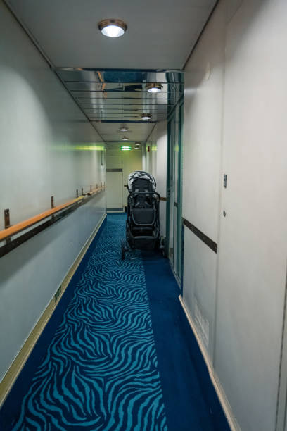 istock Empty corridor of a ship with a stroller outside a cabin 1146305234