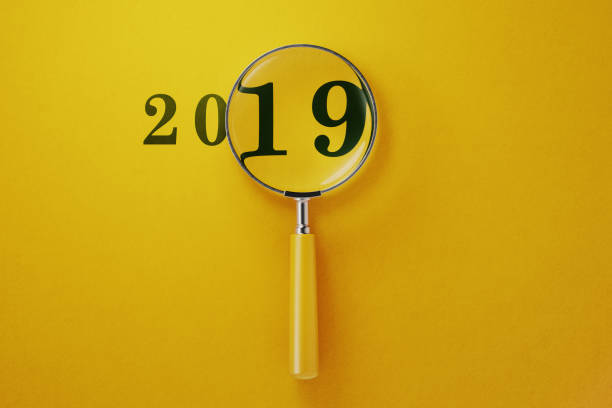 istock Magnifier And 2019 On Yellow Background 1146305715