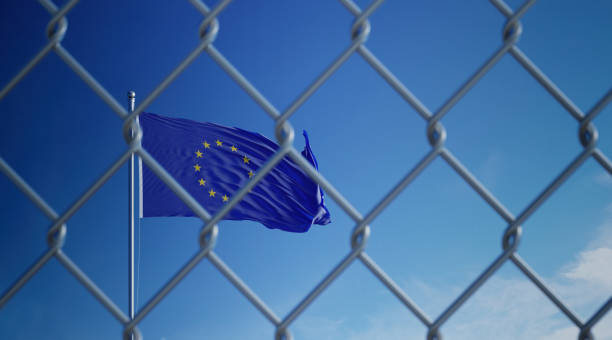 istock Fence In Front Of European Union Flag 1146307083