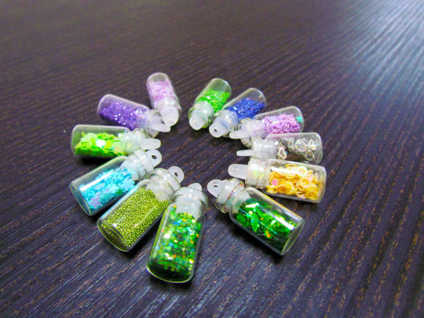 istock Multicolored jewelry for nails in small jars 1146307332