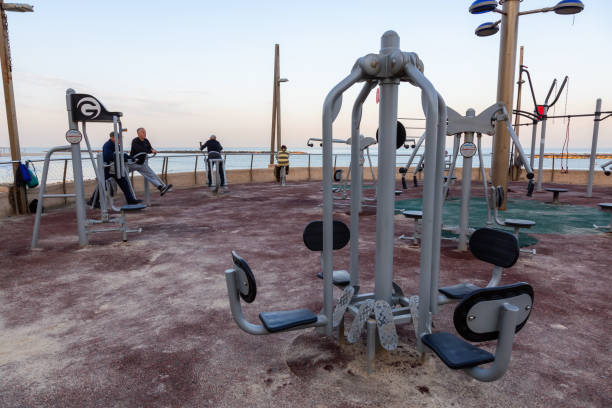 Netanya, Israel - April 3, 2019: Outdoor gym at the beach during a vibrant sunny sunrise.