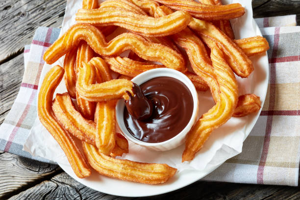 istock Traditional Spanish dessert churros on a white platter 1146309890