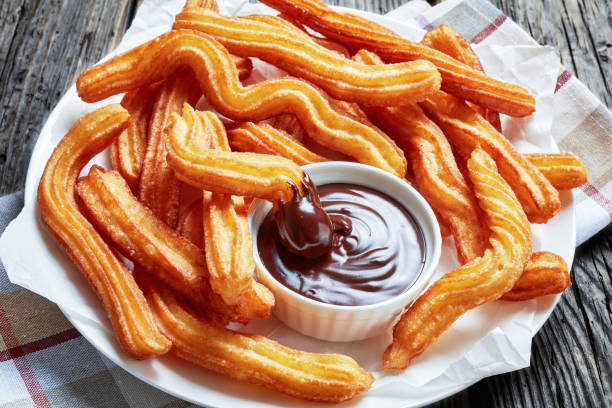 istock Traditional Spanish dessert churros on a white platter 1146309925