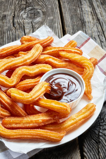 istock Traditional Spanish dessert churros on a white platter 1146310005