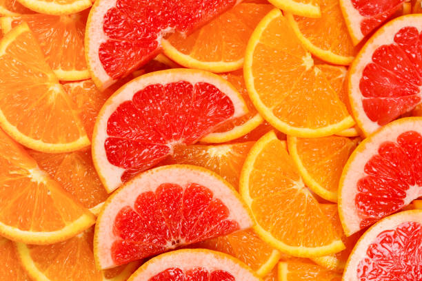 istock Slices of oranges and a grapefruits as a background. 1146311640