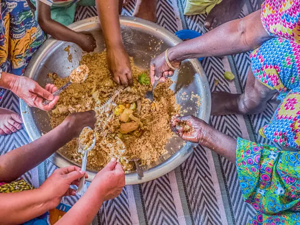 Senegal family eating together in the traditional manner. Senegal. Africa.