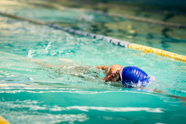 istock Confident man swimming in the pool 1146313177
