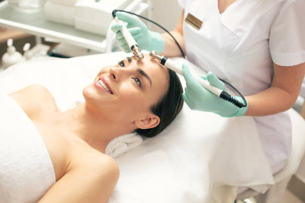 istock Happy woman enjoying microcurrent therapy and smiling 1146315332