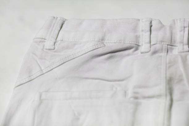 istock Button and back pocket of white jeans pants 1146316179