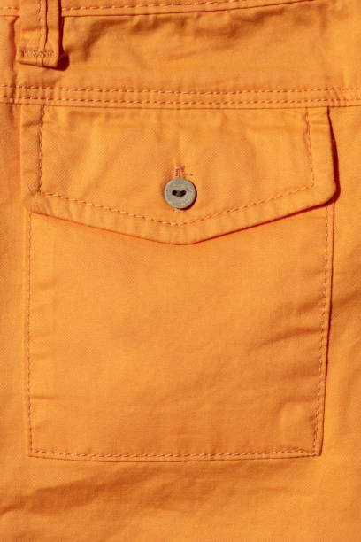 istock Back pocket of orange pants close-up 1146316447