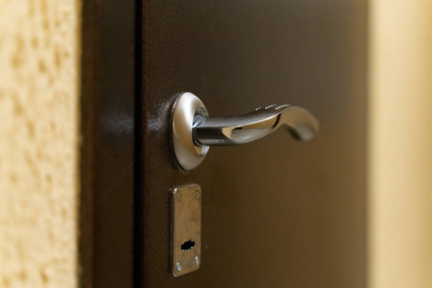 istock chrome door handle with lock on metal front door 1146316465