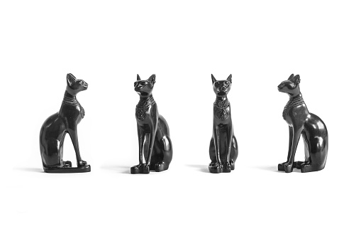Egyptian cat statues isolated on white background - set