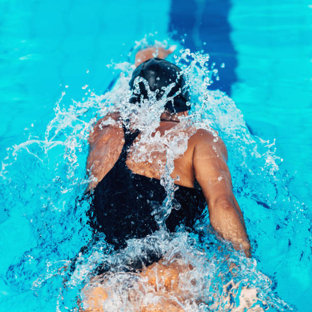 istock Back view of crawl swimmer 1146320927