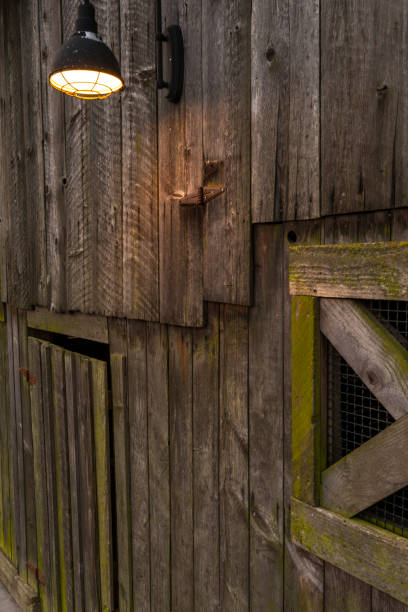 istock Outdoor wall lamp on an old wood barn 1146321050